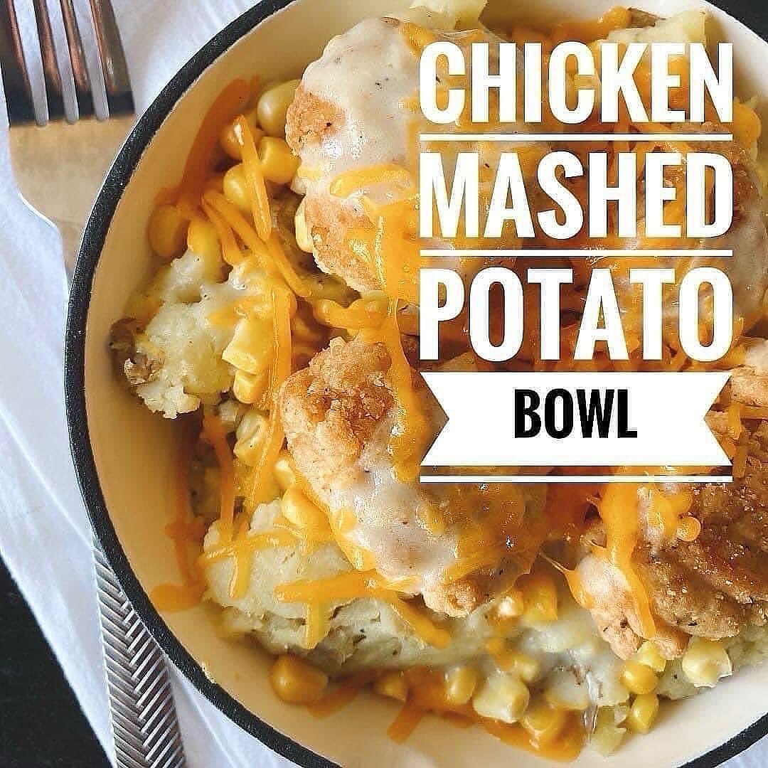 Chicken mashed potato bowl with cheese and corn in a white bowl.